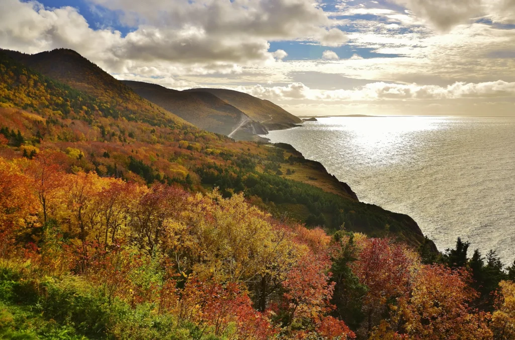 Autumn colours on the Cabot Trail highlands above the ocean in Cape Breton