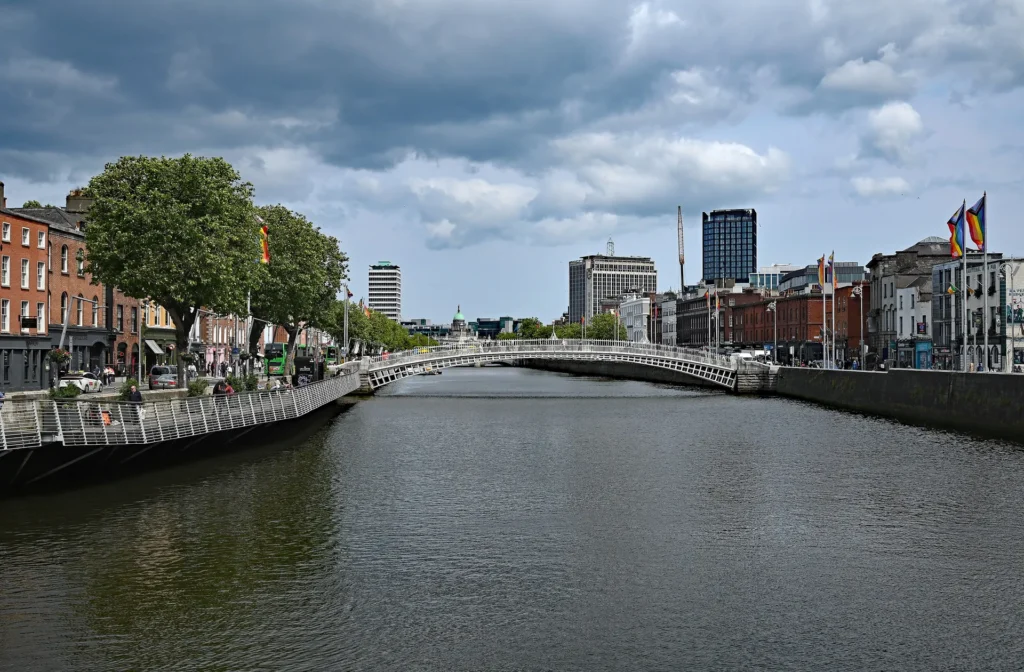 The River Liffey in Dublin, Ireland, with the Ha'penny Bridge in the distance